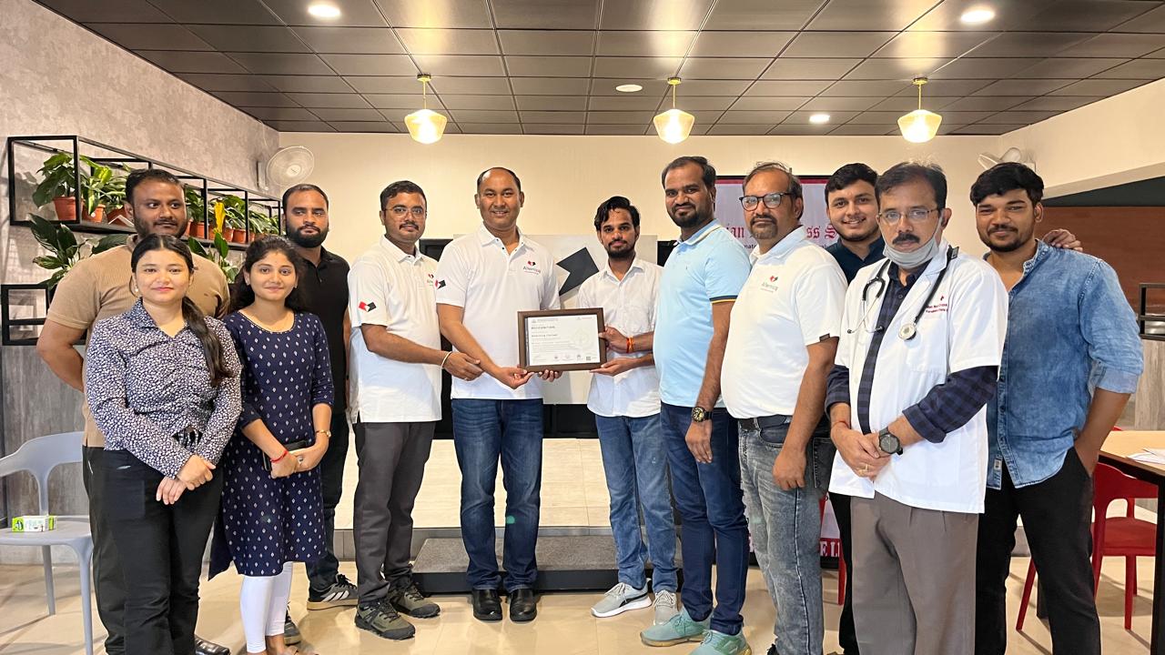 Donor receiving certificate at PFMECT blood donation camp Bangalore