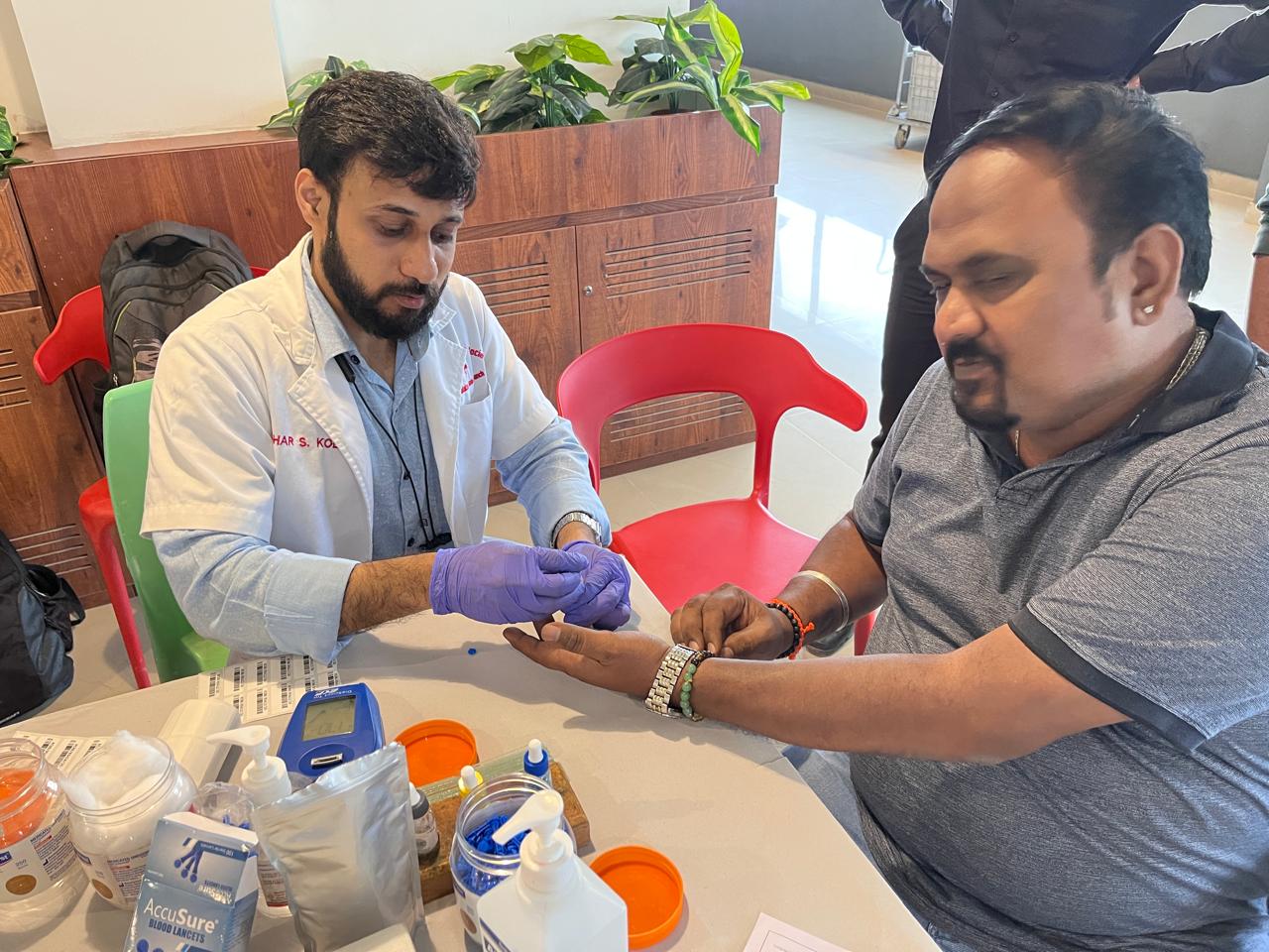 Volunteers assisting donors at PFMECT Bangalore blood drive