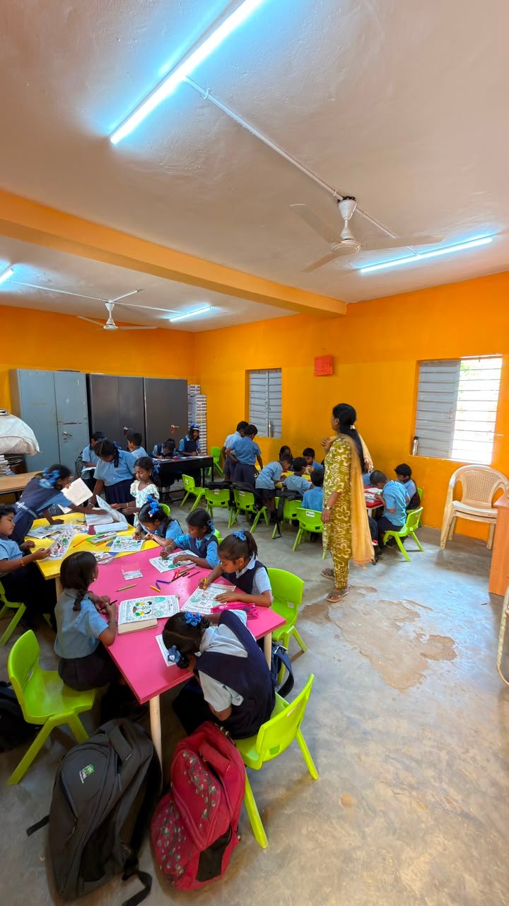 Students expressing their ideas about India through coloring