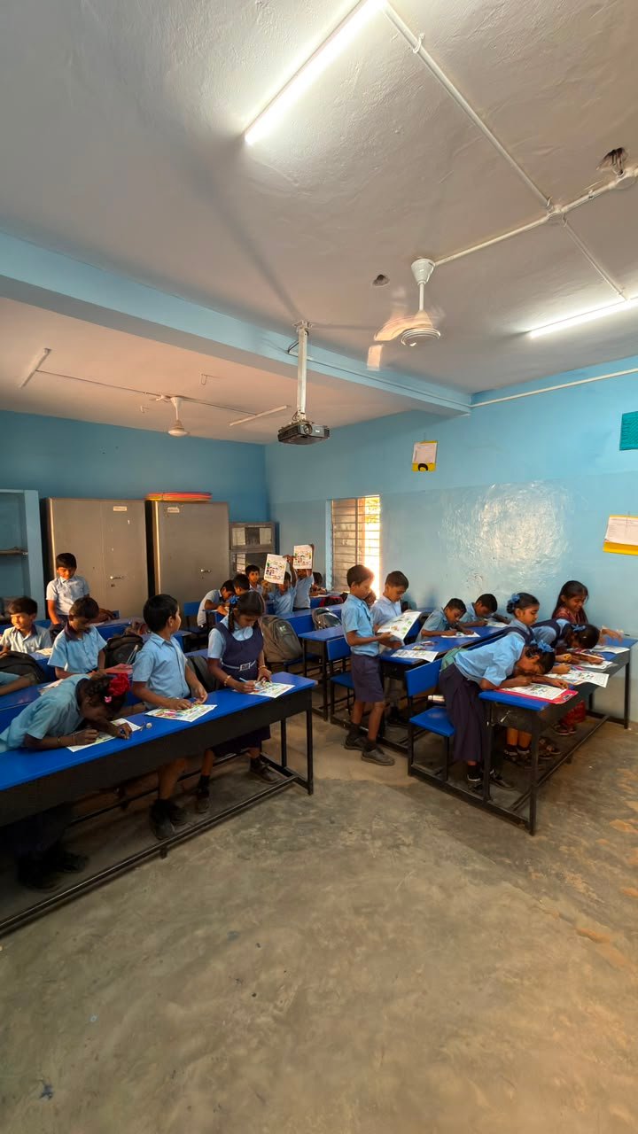 Students participating in artwork activity during Independence Day programme at Shanthipura