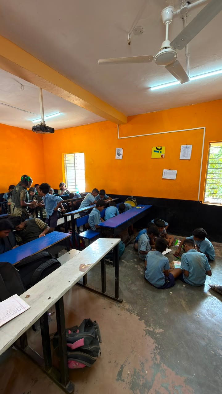 Students participating in artwork activity during Independence Day programme at Shanthipura