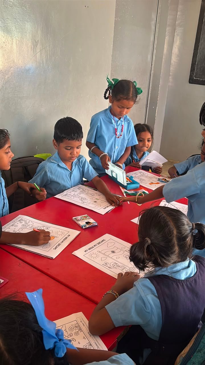Students participating in artwork activity during Independence Day programme at Shanthipura