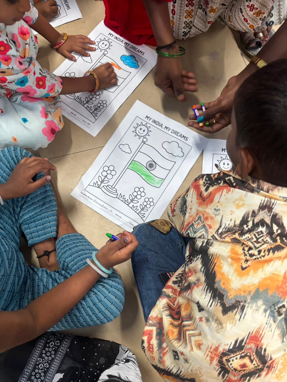 Students participating in artwork activity during Independence Day programme at Shanthipura