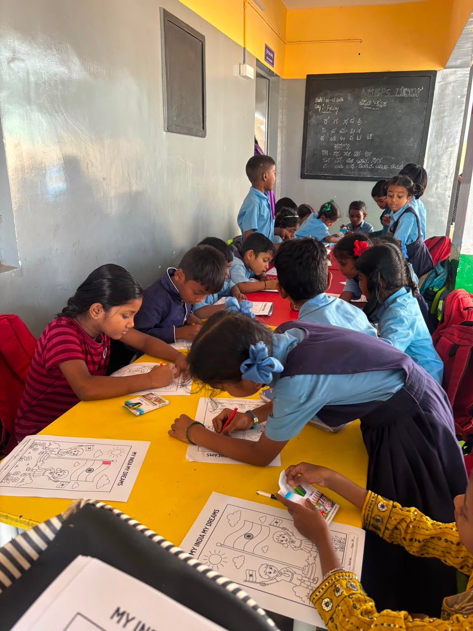 Students participating in artwork activity during Independence Day programme at Shanthipura