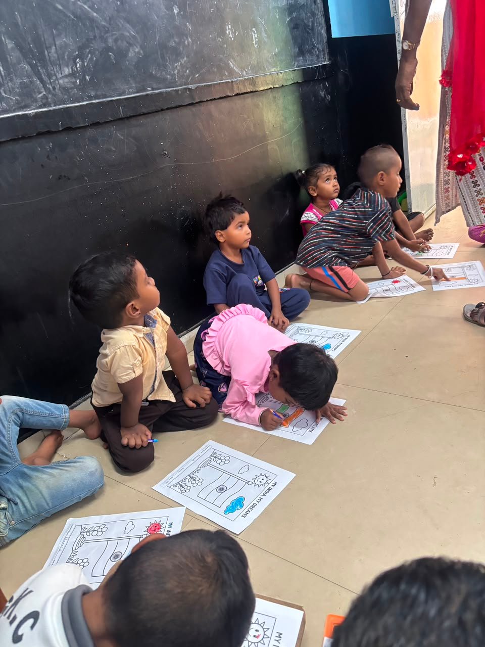 Students participating in artwork activity during Independence Day programme at Shanthipura