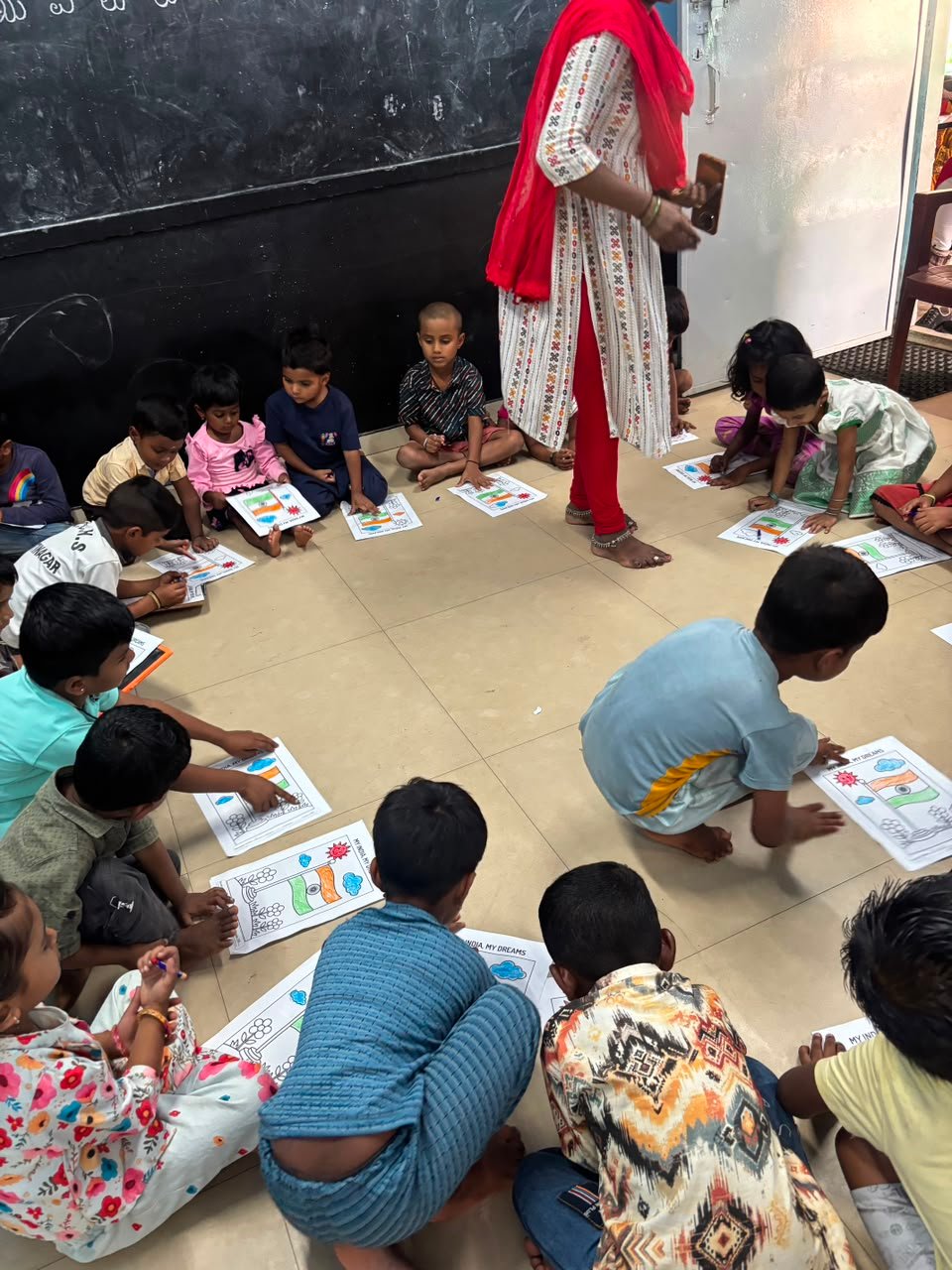 Students participating in artwork activity during Independence Day programme at Shanthipura
