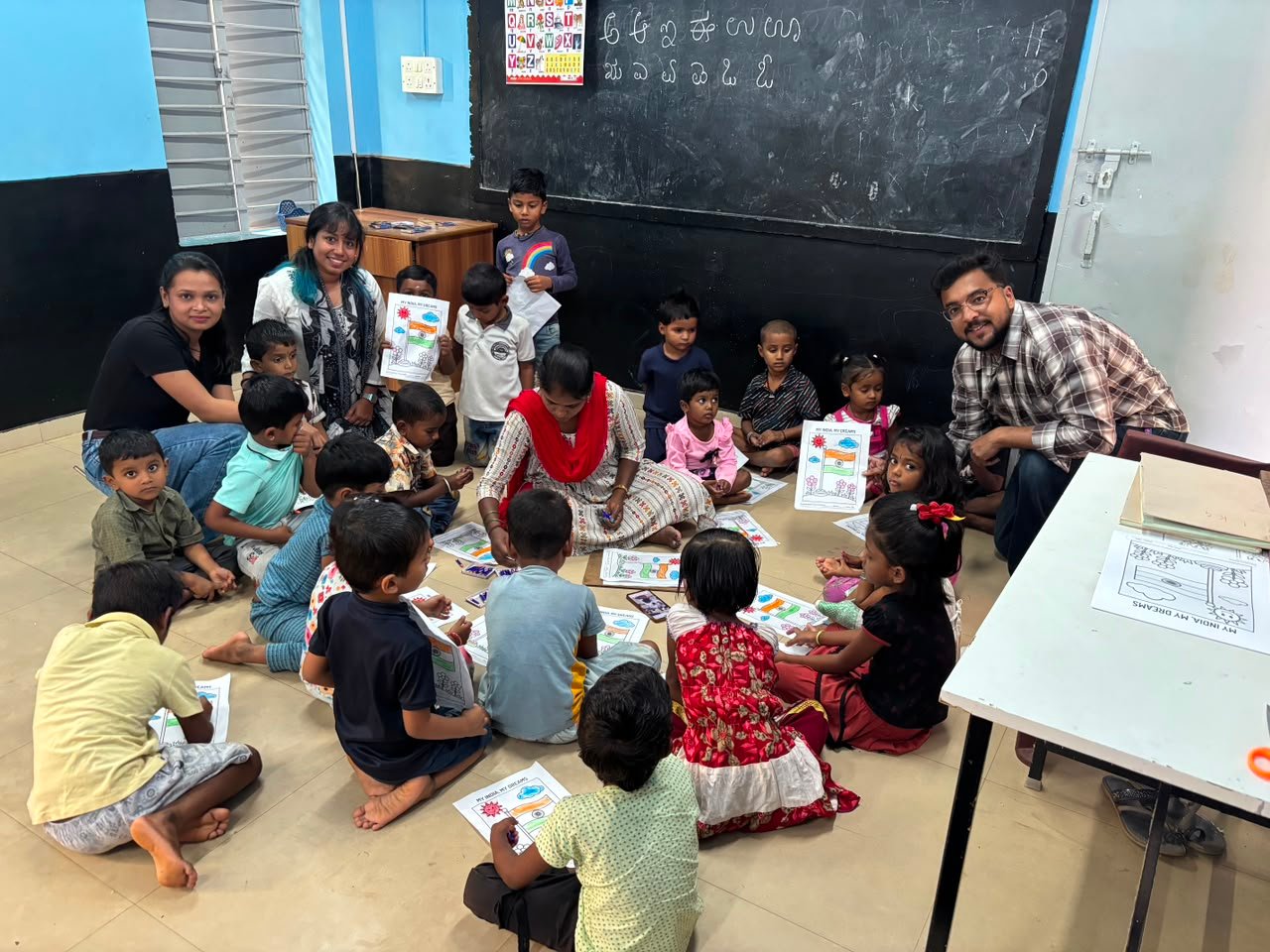 Volunteers with students during art competition
