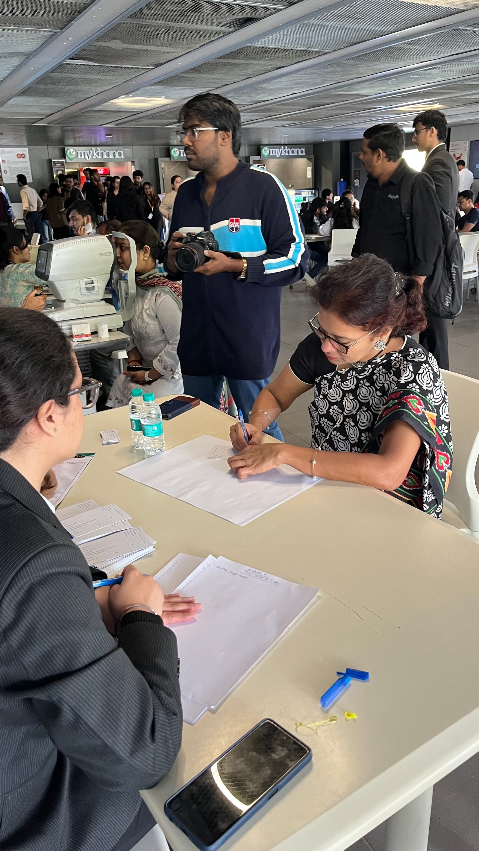 Oral health counselling taking place at the screening table